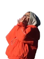 Side view of the orange Marty Supreme jacket showing the sleeve details.