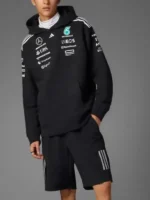 Model wearing the Adidas Mercedes AMG Petronas Formula 1 fan hoodie in black, perfect casual wear and street style.