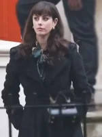 Susie Glass wearing her long black coat from The Gentlemen Netflix series, featuring a streamlined and elegant silhouette Susie Glass Black Coat.