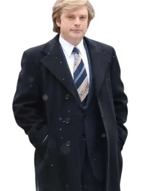 Sebastian Stan trench coat in a dark color with a wide collar, portraying Donald Trump in the film.