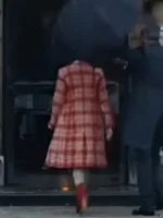 Back view of Kaya Scodelario in the striking Susie Glass plaid coat as seen in The Gentlemen 2024, showcasing the fit-and-flare silhouette.