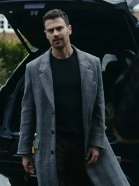 Theo James Gray Trench Coat Netflix black coat with a silk scarf, highlighting the tailored look and sharp collar in The Gentlemen series.