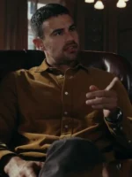 Close-up of Theo James brown shirt The Gentlemen look, highlighting the soft texture of the brown collared shirt worn by Eddie Horniman.