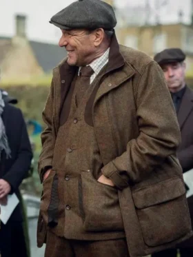 Vinnie Jones Brown Jacket from The Gentlemen 2024. This classic tweed coat is part of the Geoff Seacombe outfit.