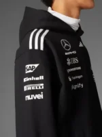 Adidas x Mercedes AMG Petronas F1 Team black hoodie with PETRONAS, CROWDSTRIKE, and sponsor logos on the back, great fan gear.