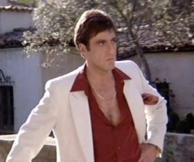 Al Pacino costume as Tony Montana wearing a white jacket over a red shirt.