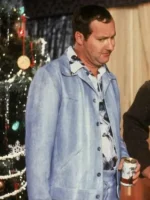 Randy Quaid as Cousin Eddie in powder blue leisure jacket holding beer beside decorated Christmas tree in National Lampoon's Christmas Vacation