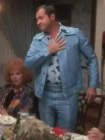 Randy Quaid as Cousin Eddie in powder blue leisure suit at Christmas Eve dinner table in National Lampoon's Christmas Vacation