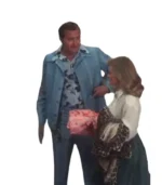 Randy Quaid as Cousin Eddie in powder blue leisure jacket with woman holding wrapped Christmas gift from National Lampoon's Christmas Vacation