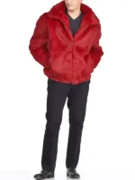 Striking red fox fur jacket mens with a large collar, worn over light-wash jeans. A stylish fur jacket men.