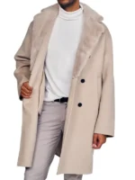 Stylish men wool trench coat featuring a wide, plush collar and black buttons, worn over a white turtleneck.