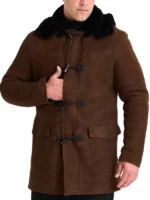 Warm brown shearling sheepskin coat mens, durable leather coat with black trim and patch pockets.