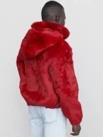 Mens faux fur jacket in vibrant red. Short, bomber-style faux fur jacket men with a collar and zipper closure.