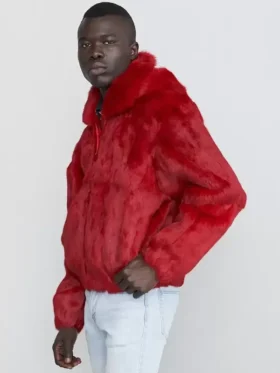 Striking red fox fur jacket mens with a large collar, worn over light-wash jeans. A stylish fur jacket men.