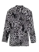 Front view of Ashley Park in a stylish grey leopard printed blazer with sharp lapels.