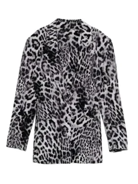 Front view of Ashley Park in a stylish grey leopard printed blazer with sharp lapels.