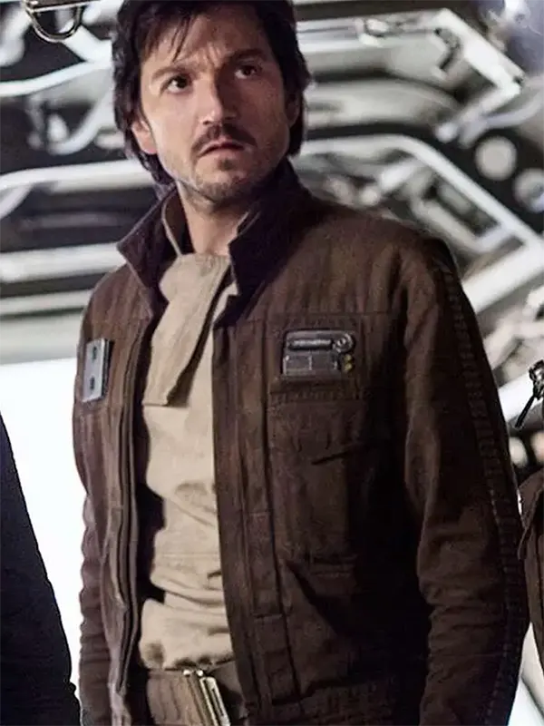 Captain-Cassian-Andor-Jacket-for-mens A man wearing a dark brown rebel-style jacket with a yellow badge, inspired by Cassian Andor.