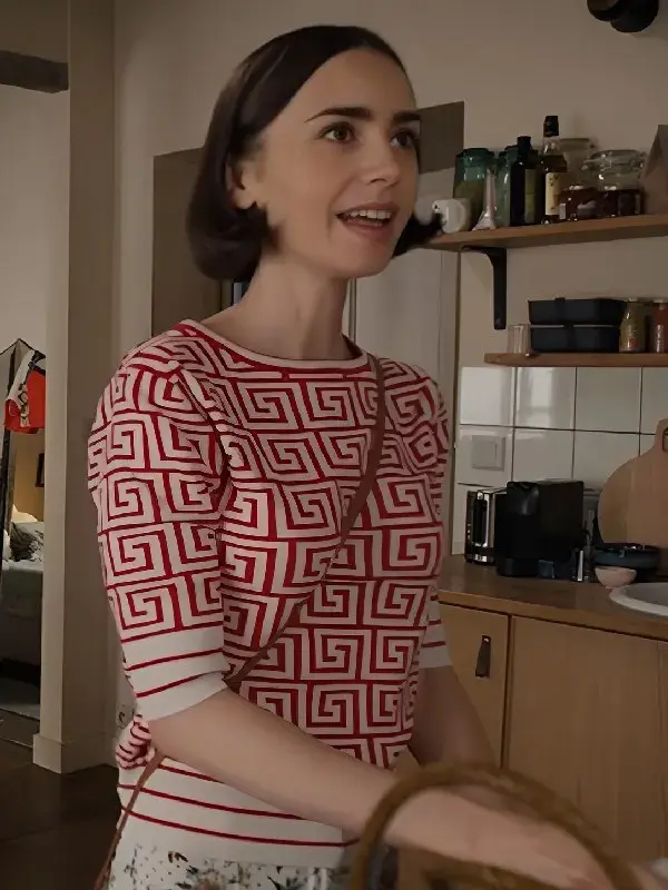 Emily Cooper Geometric Print Top A close-up of the trendy Emily Cooper geometric print top with a modern pattern.