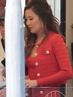 Ashley Park as Mindy Chen in Emily in Paris Season 5 wearing a coordinated red Retrofete knitted outfit.
