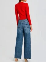 The back view of the Ashley Park red knitted jacket from Emily in Paris S05 showcasing the tailored knit silhouette.