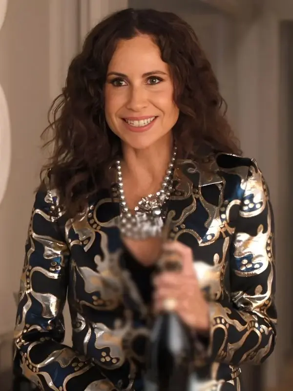 Emily In Paris S05 Minnie Driver Black Blue Jacquard Blazer Minnie Driver as Elizabeth Robertson in Emily in Paris S05 wearing a black and blue jacquard blazer.