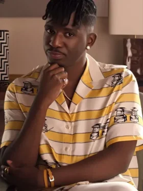 Samuel Arnold wearing a Yellow Striped Shirt with a crisp white collar in Emily in Paris S05.