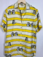 A front view of Samuel Arnold in a Yellow Striped Shirt with a crisp button-up design and tailored fit.