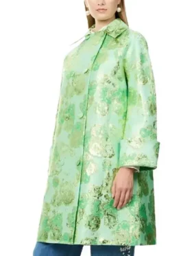 Lily Collins wearing a Floral Jacquard Coat with a vibrant green base and ornate botanical patterns.