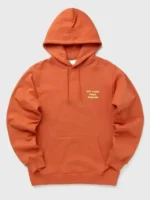 Front view of a vibrant Orange Slogan Hoodie with a modern graphic design.