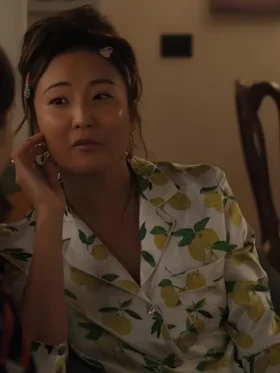 Ashley Park as Mindy Chen in Emily in Paris S05 wearing a stylish coordinated printed pajama set.