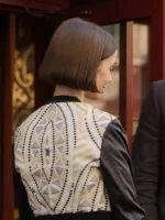 The back view of a tailored Emily Cooper Jacket with clean seams and a structured waistline.