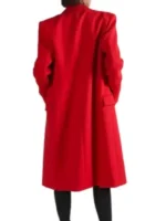 A back view of the Lily Collins Red Coat showing its elegant longline cut and central vent detail.