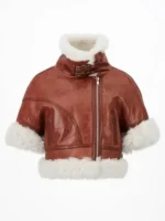 Front view of Sydney Sweeney in a trendy cropped aviator leather jacket.