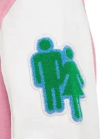 Close-up of the decorative patch on the right sleeve of the mens pink varsity jacket.