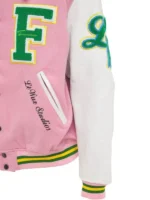 Close-up of the left side of the white and pink letterman jacket.