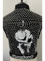 Close-up of the logo patches and silver studs on the Juice Wrld vest.