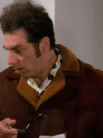 Michael Richards wearing his signature brown jacket in the show Seinfeld.