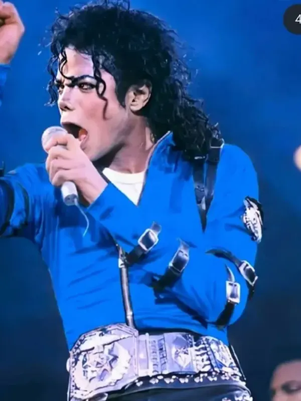 Close-up of the signature adjustable belt straps on the sleeves of the MJ blue satin jacket.