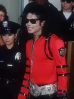 A full-length performance-style shot of the red Michael Jackson Bad tour satin jacket.