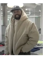 Full view: beige Yeezy Pixar hooded bomber jacket with rib-knit cuffs.