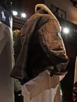 The back of the 2026 Team USA brown leather jacket showing the large stars-and-stripes patch and branding.