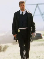 Brad Pitt wearing a long black leather trench coat in the movie Se7en.