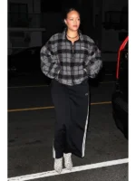 Celebrity inspired checked teddy fleece jacket worn by Rihanna, designed for cozy street style with a modern zip-up finish.