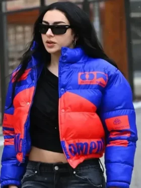 Full shot of the blue and red puffer jacket worn by Charli XCX at Sundance 2026 from TV Jackets.
