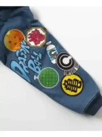 Close-up of the Dragon Ball Z patches on the chest and sleeves of the denim jacket.