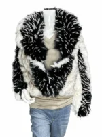 A close-up of Erin Andrews interviewing a player, highlighting the intricate texture and high-pile fibers of her luxury fur coat.