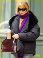 Front view of the black Jennifer Lawrence puffer coat showing the clean matte finish.
