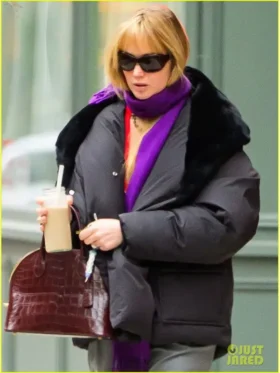 Front view of the black Jennifer Lawrence puffer coat showing the clean matte finish.