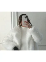 Front close-up of Kennedy Stidham white vegan fur coat showing plush texture, neat finishing, and clean winter-white look.