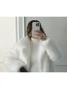 Front close-up of Kennedy Stidham white vegan fur coat showing plush texture, neat finishing, and clean winter-white look.